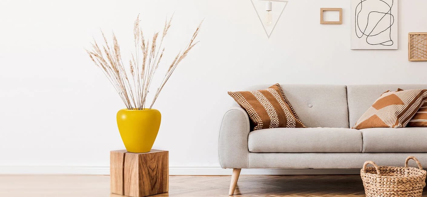 Flower Pot in yellow colour placed in living room