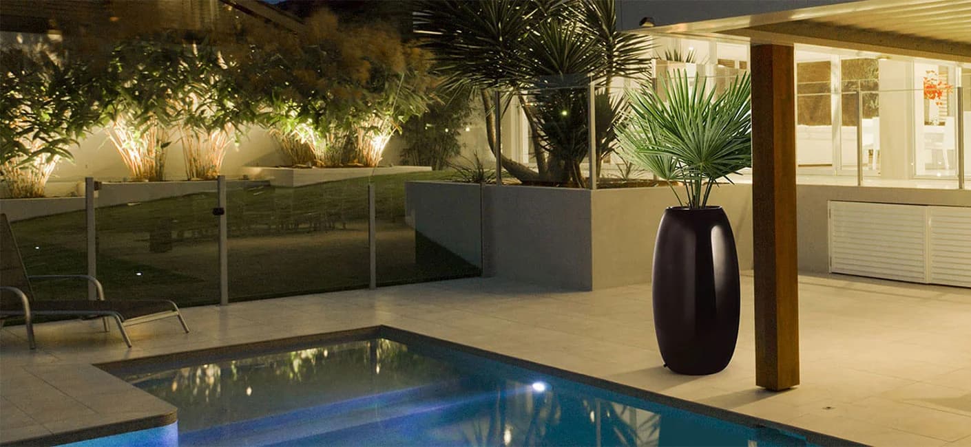 black tall FRP planter placed in the verandah